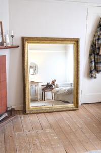 Antique bevelled mirror with wooden detailed frame