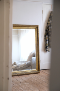 Antique bevelled mirror with wooden detailed frame