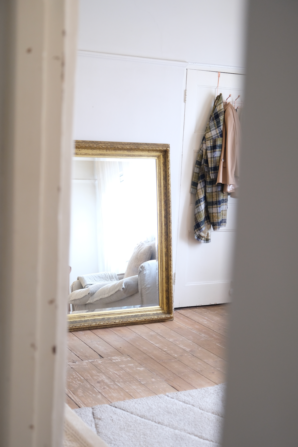 Antique bevelled mirror with wooden detailed frame