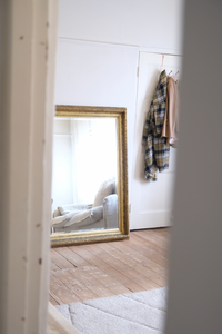 Antique bevelled mirror with wooden detailed frame