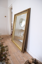 Load image into Gallery viewer, Antique bevelled mirror with wooden detailed frame
