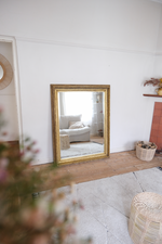 Load image into Gallery viewer, Antique bevelled mirror with wooden detailed frame
