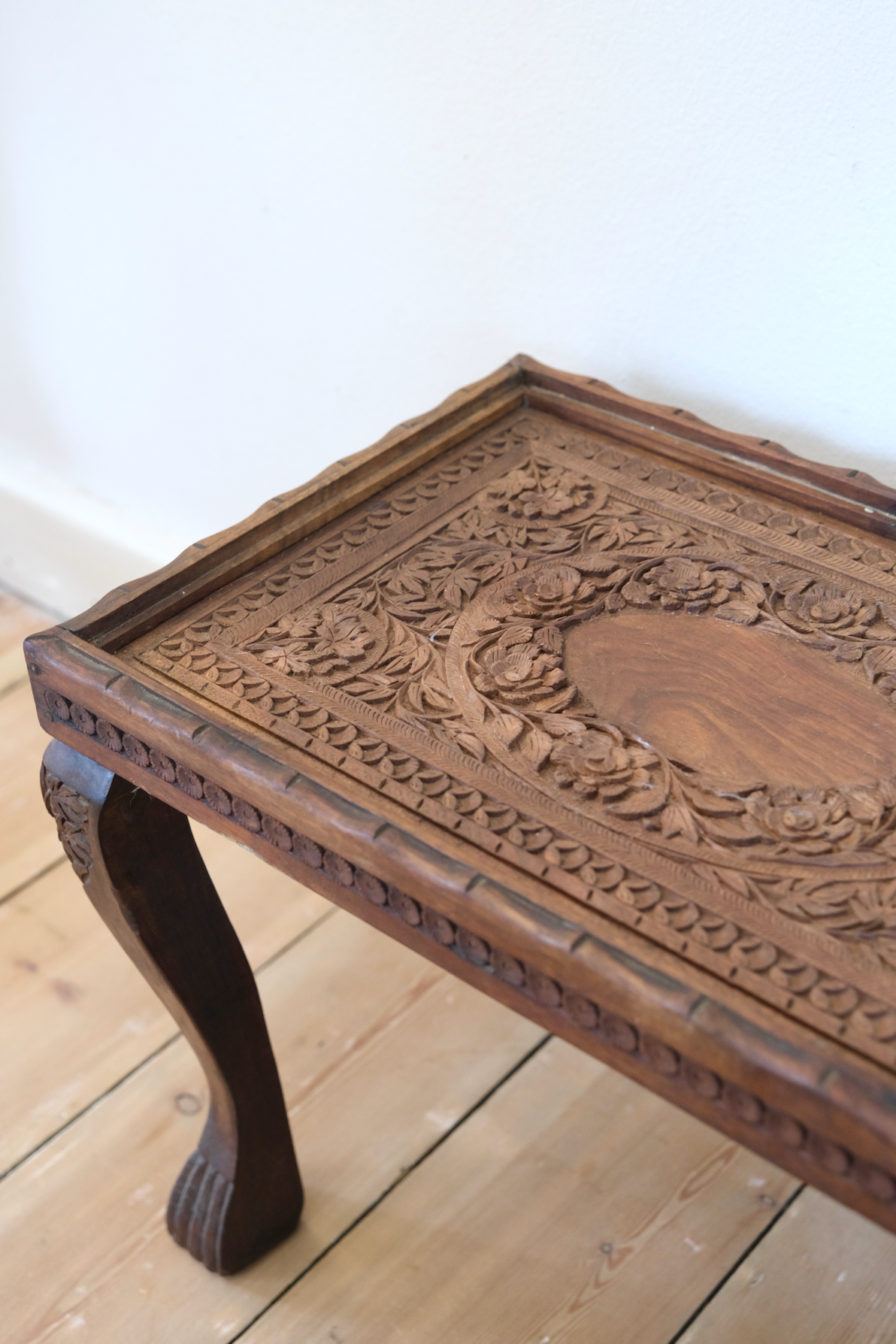 Wood carved stool with glass top