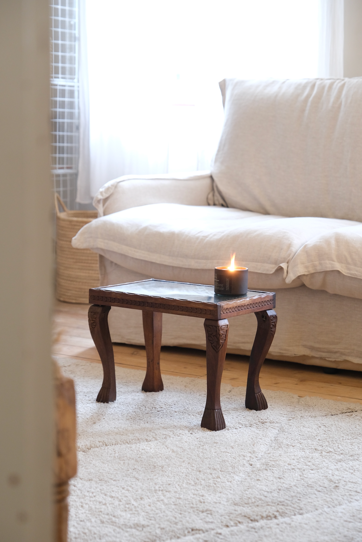 Wood carved stool with glass top