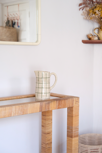 Cane and glass top console