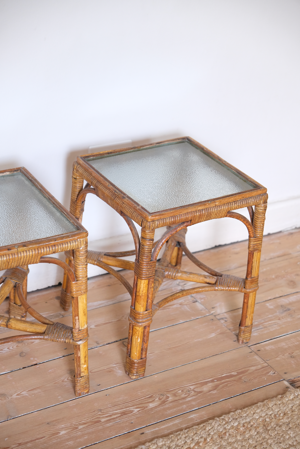 A pair of cane side tables