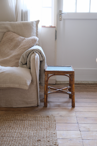 A pair of cane side tables