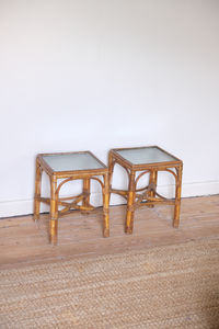 A pair of cane side tables