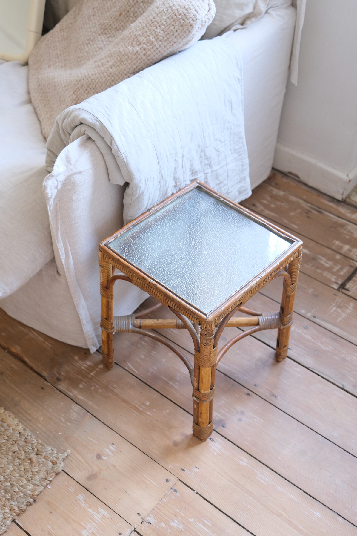 A pair of cane side tables