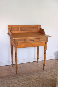 Wooden desk with carved legs