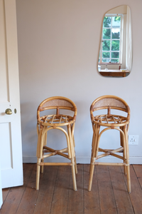 Four beautiful cane bar stools