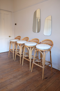 Four beautiful cane bar stools