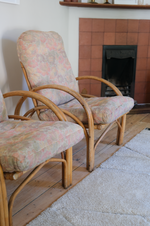 Load image into Gallery viewer, Pair of cane chairs with flower print cushions
