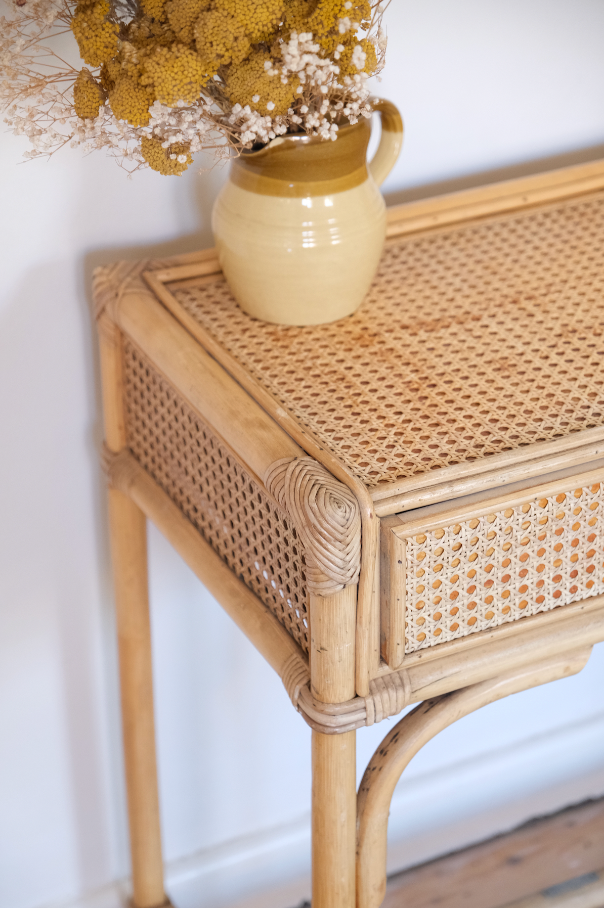 Cane console with drawer