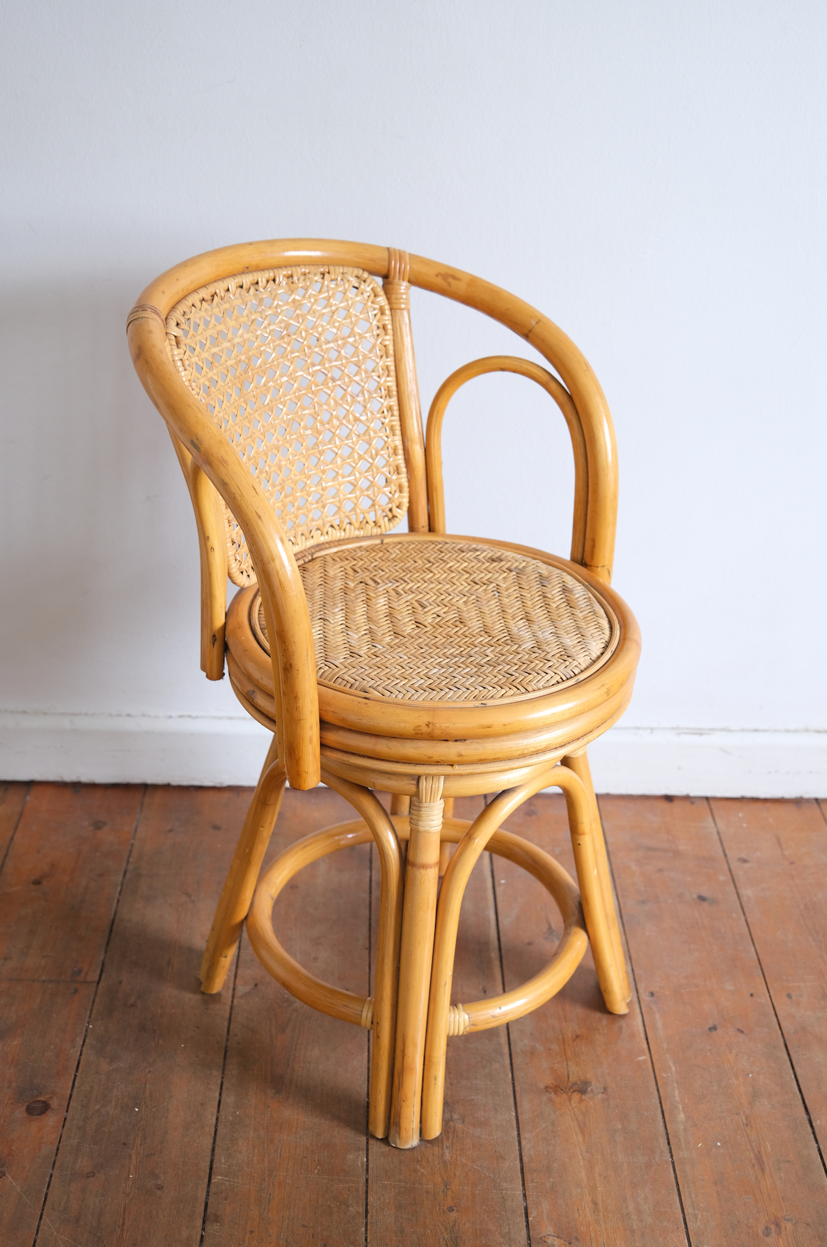 Pair of swivel cane chairs